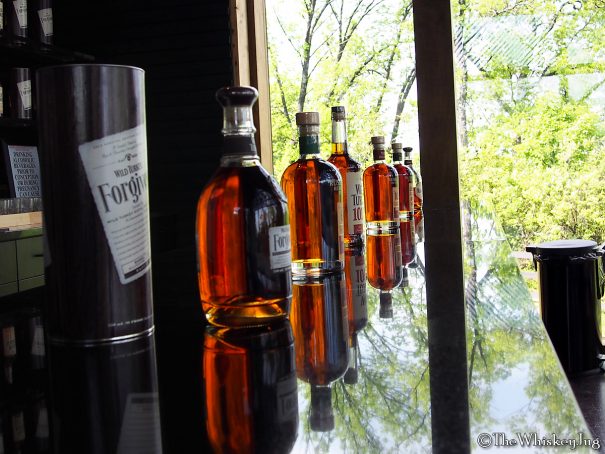 Wild Turkey bottles lined up on a counter inside of the Wild Turkey Distillery