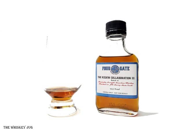 White background tasting shot with the Four Gate Kelvin Collaboration 3 sample bottle and a glass of whiskey next to it.