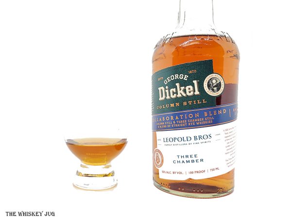 White background tasting shot with the George Dickel x Leopold Bros Collaboration Blend Rye bottle and a glass of whiskey next to it.